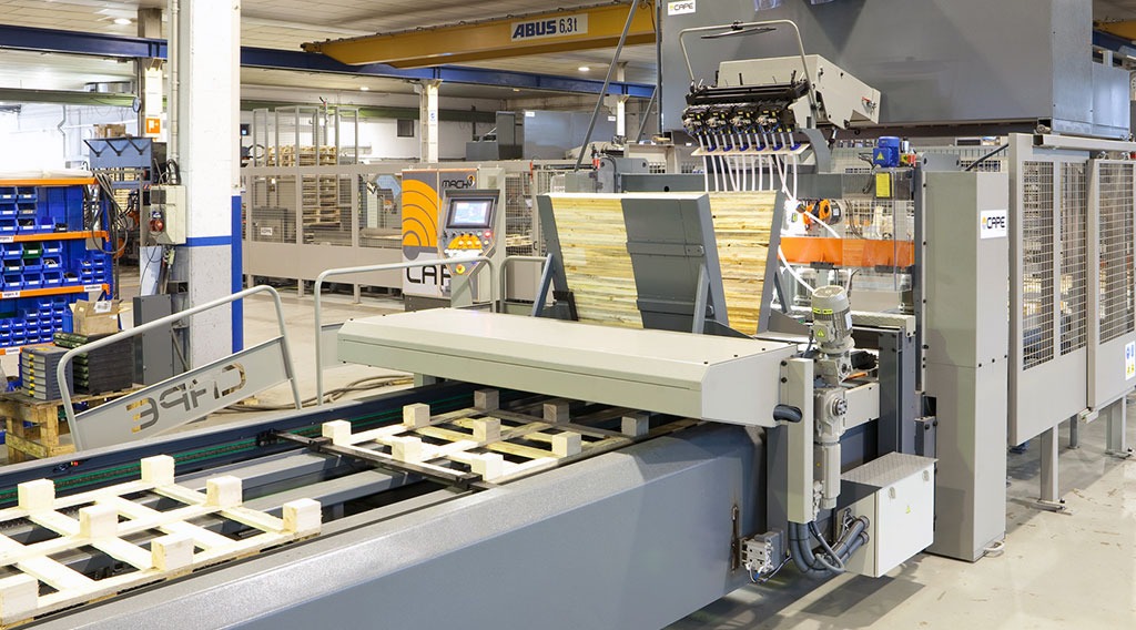 Automated Pallet Manufacturing Assembly Line Automated wooden pallet manufacturing machine assembling deckboards in factory