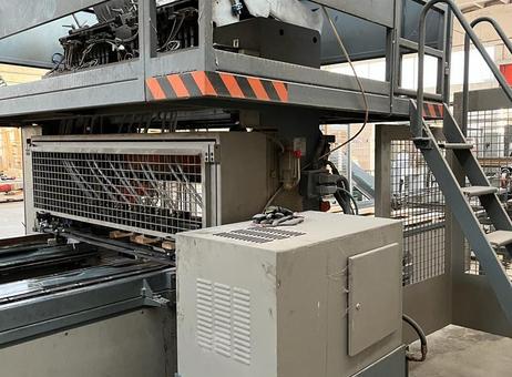 Industrial Automated Pallet Manufacturing Station Heavy-duty automated wooden pallet manufacturing machine with control unit and safety enclosure